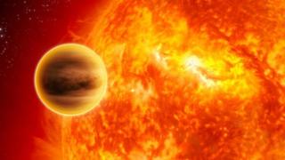 Un planeta al lado de una estrella