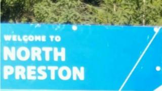 A roadside sign welcoming people to the community of North Preston