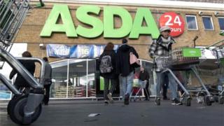 Shoppers outside an Asda store