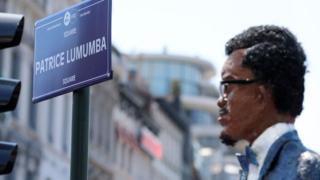 A picture shows an effigy of Patrice Lumumba during the opening of "Square Patrice Lumumba", the first public place in the former colonial power to honour late Congolese independence hero, on June 30, 2018 in Brussels. Lumumba was the first Prime Minister of the independent Congo after its independence from Belgium