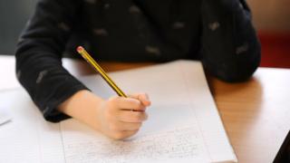 A pupil writing