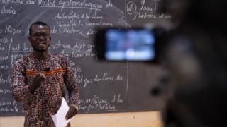 A philosophy teacher gives a philosophy class for final year high school students filmed by Burkina Info TV in Ouagadougou, Burkina Faso - Monday 30 March 2020