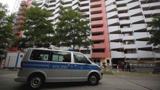 Police van at suspect's apartment block, Cologne, 14 Jun 18