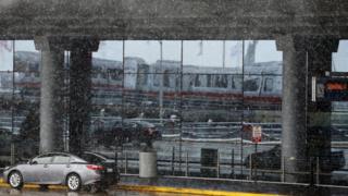Snow falls outside Chicago's O'Hare airport, the nation's fourth busiest airport