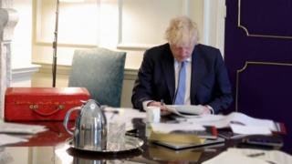 Boris Johnson reading Sue Gray's report