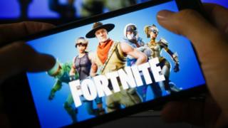 Fortnite on cell phone screen.