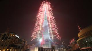 Fireworks illuminate the sky around Burj Khalifa, the tallest building in the world, during New Year's 2019 celebrations in the Gulf emirate of Dubai, United Arab Emirates, 1 January 2019