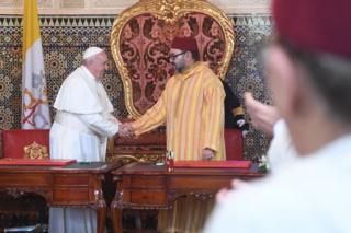 Pope Francis shakes the hand of King Mohammed VI of Morocco in Rabat, 30 March
