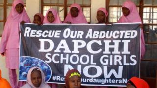 Schoolgirls wait for the arrival of Nigeria"s President Muhammadu Buhari at the Goverment girls" science and technical college in Dapchi, Nigeria March 14, 2018