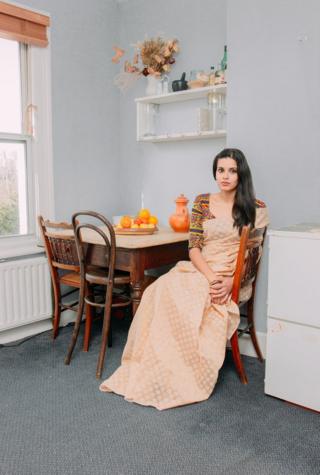 Portrait of woman in her home