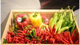 East-West Seed vegetables in a wooden cart