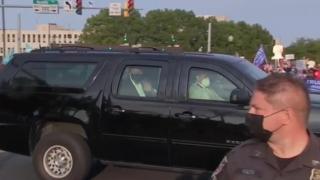 President Trump looking inside a car in front of Walter Reed Medical Center