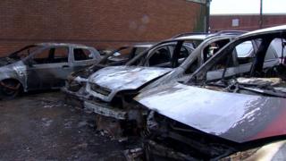 The burnt-out cars in Carrickfergus