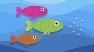illustration of three fish swim towards plastic pieces floating in water