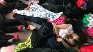 A handout photo made available by NGO "SOS Mediterranee" shows migrants resting on the ship Aquarius, in the Mediterranean Sea, 14 June 2018