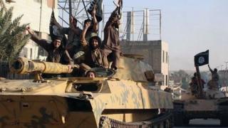 Islamic State fighters drive armoured vehicles through Raqqa, Syria (30 June 2014)