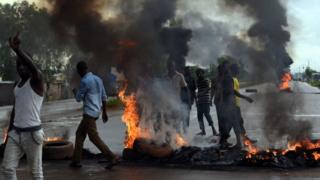 People protest against the coup with roadblocks and burning tyres, 19 Sept