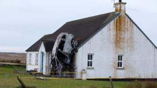 Car crashed into house