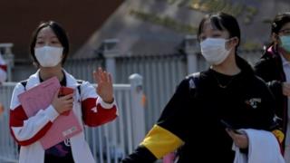 Students wearing face masks leave a school in Beijing, China as senior high school students in the Chinese capital returned to campus following the coronavirus disease (COVID-19) outbreak, April 27, 2020.