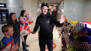 Jonathan Rea gives high-fives to some of his young fans