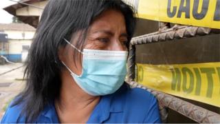 Mother looks at jail cell