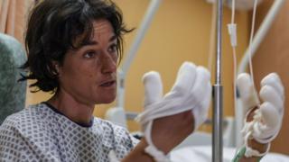 French mountaineer Elisabeth Revol talks to journalists in a French hospital