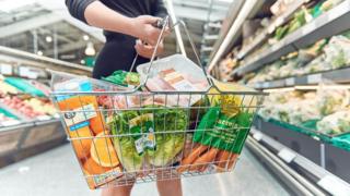 Woman holding shopping basket