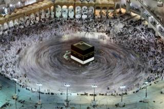 This long exposure photograph shows Muslim pilgrims circumambulation of the Kaaba, Islam's holiest shrine, at the Grand Mosque in Saudi Arabia's holy city of Mecca on 27 August 2017, prior to the start of the annual Hajj pilgrimage