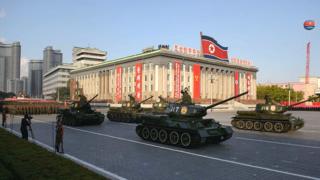 North Korean military vehicles pass through Kim Il-Sung square during a mass military parade in Pyongyang on October 10, 2015.