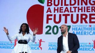 Michelle Obama addresses the Healthier America Summit with former White House chef and Senior Policy Advisor for Nutrition Policy Sam Kass. 12 May 2017