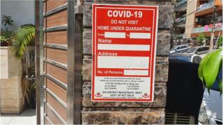 A house in Delhi with a home quarantine sticker