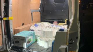 Toilet rolls in the back of a van