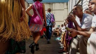 Models present crochet clothing creations made by inmates as part of "Ponto Firme" project in the Adriano Marrey maximum security penitentiary in Guarulhos, Brazil on May 22, 2019.