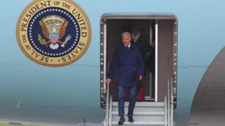 President Biden descends the steps of the presidential jet in Dublin
