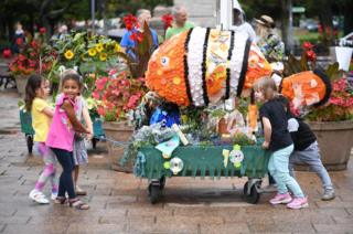 Upcycled planters made by children from plastic collected in beach clean-ups