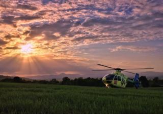 Air ambulance at sunset