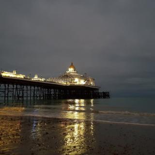 Reflections of a pier in the sea