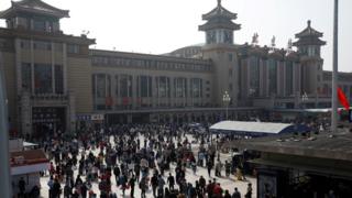People outside Beijing Railway station