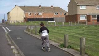 Boy plays on the street in Hartlepool
