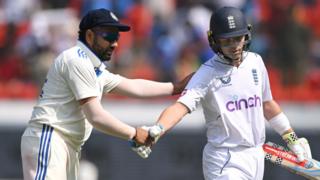 Ollie Pope is congratulated by Rohit Sharma