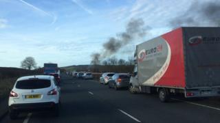 Car fire and traffic on the A55