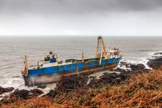 A view of the abandoned ghost ship Alta stuck on the rocks of the Irish coast