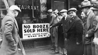 A sign reading n booze sold here in New York, 1929