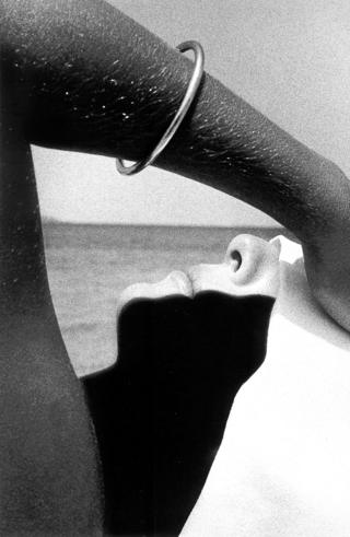 Woman with hand on her head