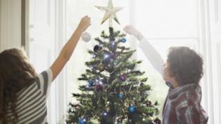 Kids decorating Christmas Tree