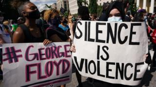 signs at a George Floyd protest