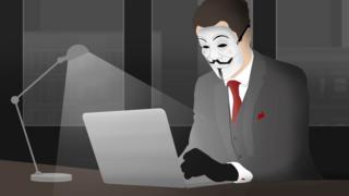 A hacker using a laptop