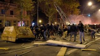 Protesters throw different objects at police in Barcelona. Photo: 16 October 2019