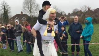 A man carrying his 'wife'