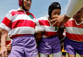 Members of Tokyo's Fuwaku Rugby Club train outdoors